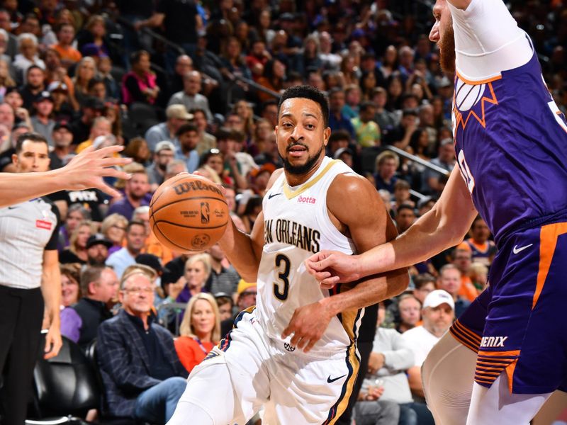 PHOENIX, AZ - APRIL 7: CJ McCollum #3 of the New Orleans Pelicans drives to the basket during the game against the Phoenix Suns on April 7, 2024 at Footprint Center in Phoenix, Arizona. NOTE TO USER: User expressly acknowledges and agrees that, by downloading and or using this photograph, user is consenting to the terms and conditions of the Getty Images License Agreement. Mandatory Copyright Notice: Copyright 2024 NBAE (Photo by Barry Gossage/NBAE via Getty Images)