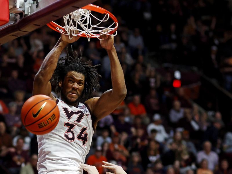 Mar 2, 2024; Blacksburg, Virginia, USA; Virginia Tech Hokies guard MJ Collins (2) and Wake Forest Demon Deacons guard Parker Friedrichsen (20) go for a loose ball during the first half at Cassell Coliseum. Mandatory Credit: Peter Casey-USA TODAY Sports