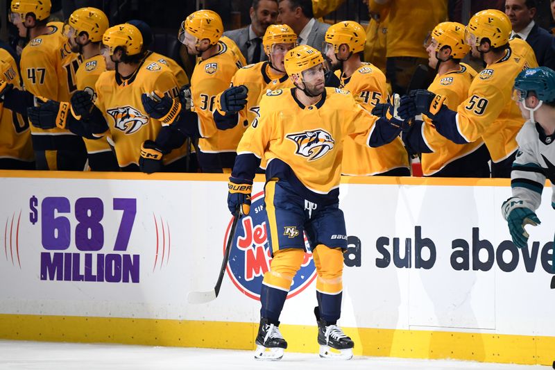 Mar 19, 2024; Nashville, Tennessee, USA; Nashville Predators left wing Jason Zucker (16) is congratulated by teammates after a goal during the second period against the San Jose Sharks at Bridgestone Arena. Mandatory Credit: Christopher Hanewinckel-USA TODAY Sports