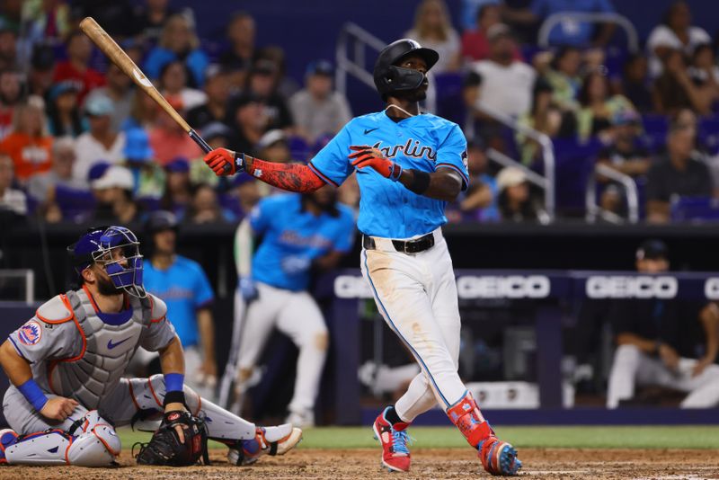 Jul 21, 2024; Miami, Florida, USA; Miami Marlins designated hitter Jazz Chisholm Jr. (2) hits a three-run home run against the New York Mets during the fourth inning at loanDepot Park. Mandatory Credit: Sam Navarro-USA TODAY Sports