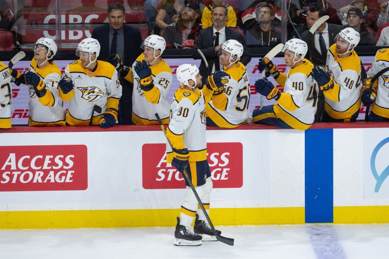 Oct 13, 2025; Ottawa, Ontario, CAN; Nashville Predators center Ryan O'Reilly (90) celebrates with teammates after scoring a goal in the third period against the Ottawa Senators at the Canadian Tire Centre. Mandatory Credit: Marc DesRosiers-IMAGN Images
