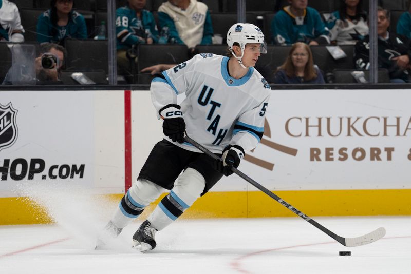 Oct 1, 2024; San Jose, California, USA;  Utah Hockey Club defenseman Vladislav Kolyachonok (52) controls the puck during the second period against the San Jose Sharks at SAP Center at San Jose. Mandatory Credit: Stan Szeto-Imagn Images
