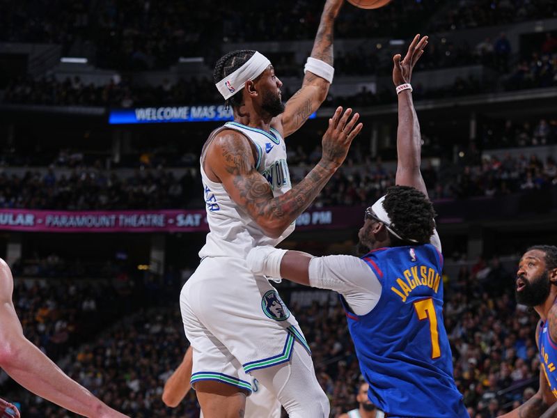 DENVER, CO - MARCH 29: Nickeil Alexander-Walker #9 of the Minnesota Timberwolves passes the ball during the game against the Denver Nuggets on March 29, 2024 at the Ball Arena in Denver, Colorado. NOTE TO USER: User expressly acknowledges and agrees that, by downloading and/or using this Photograph, user is consenting to the terms and conditions of the Getty Images License Agreement. Mandatory Copyright Notice: Copyright 2024 NBAE (Photo by Bart Young/NBAE via Getty Images)