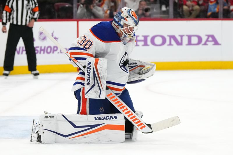 Nov 20, 2023; Sunrise, Florida, USA; Edmonton Oilers goaltender Calvin Pickard (30) blocks a shot against the Florida Panthers during the second period at Amerant Bank Arena. Mandatory Credit: Jasen Vinlove-USA TODAY Sports