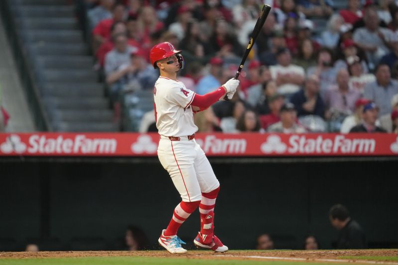 Apr 30, 2024; Anaheim, California, USA; Los Angeles Angels shortstop Zach Neto (9) hits a home run in the third inning against the Philadelphia Phillies at Angel Stadium. Mandatory Credit: Kirby Lee-USA TODAY Sports
