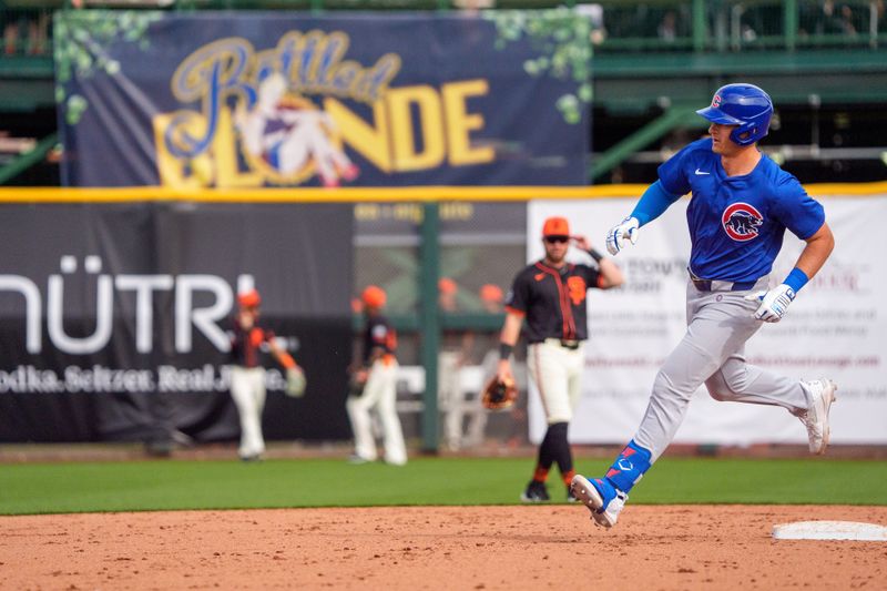 Feb 24, 2024; Scottsdale, Arizona, USA; Chicago Cubs infielder Chase Strumpf (98) rounds the bases after hitting a home run against the San Francisco Giants in the ninth inning during a spring training game at Scottsdale Stadium. Mandatory Credit: Allan Henry-USA TODAY Sports