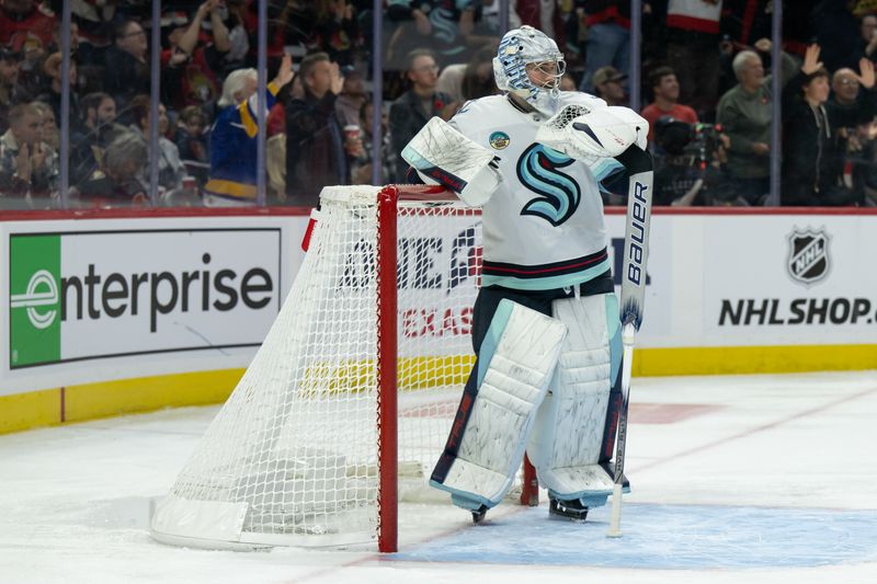 Nov 2, 2024; Ottawa, Ontario, CAN; Seattle Kraken goalie Philipp Grubauer (31) looks up the ice during the first period against the against the Ottawa Senators at the Canadian Tire Centre. Mandatory Credit: Marc DesRosiers-Imagn Images