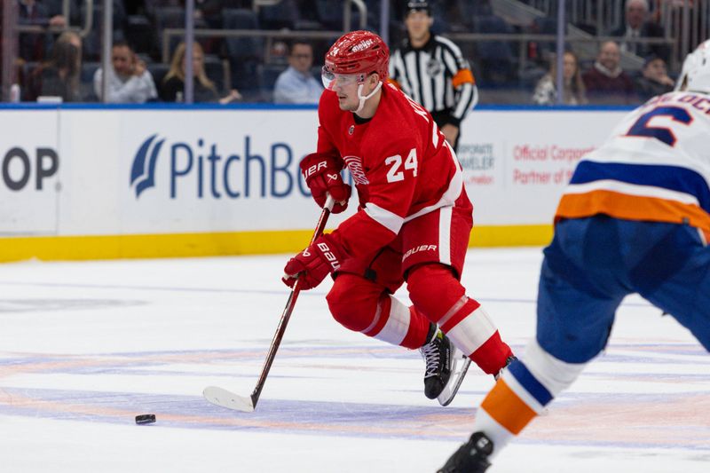 Oct 30, 2023; Elmont, New York, USA; Detroit Red Wings center Klim Kostin (24) moves the puck against the New York Islanders during the third period at UBS Arena. Mandatory Credit: Thomas Salus-USA TODAY Sports