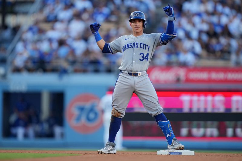 Jun 15, 2024; Los Angeles, California, USA; Kansas City Royals catcher Freddy Fermin (34) gestures after hitting a double against the Los Angeles Dodgers in the fourth inning at Dodger Stadium. Mandatory Credit: Kirby Lee-USA TODAY Sports