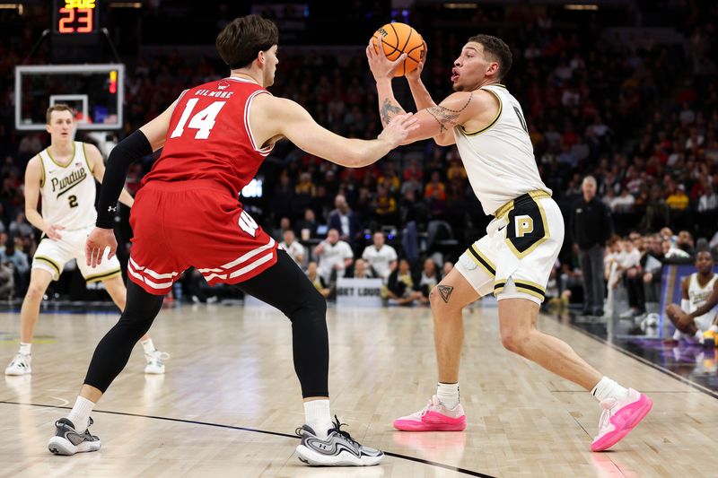 Mar 16, 2024; Minneapolis, MN, USA; Purdue Boilermakers forward Mason Gillis (0) controls the ball as Wisconsin Badgers guard Max Klesmit (11) defends during the first half at Target Center. Mandatory Credit: Matt Krohn-USA TODAY Sports