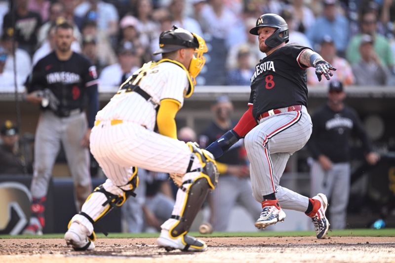 Aug 21, 2024; San Diego, California, USA; Minnesota Twins catcher Christian Vazquez (8) scores a run past San Diego Padres catcher Kyle Higashioka (20) during the fourth inning at Petco Park. Mandatory Credit: Orlando Ramirez-USA TODAY Sports