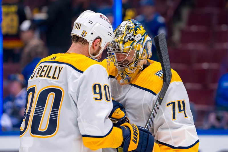 Apr 23, 2024; Vancouver, British Columbia, CAN;  Nashville Predators forward Ryan O'Reilly (90) and goalie Juuse Saros (74) celebrate their victory against the Vancouver Canucks in game two of the first round of the 2024 Stanley Cup Playoffs at Rogers Arena. Mandatory Credit: Bob Frid-USA TODAY Sports