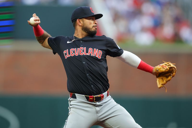 Apr 27, 2024; Atlanta, Georgia, USA; Cleveland Guardians third baseman Gabriel Arias (13) throws a runner out at first against the Atlanta Braves in the second inning at Truist Park. Mandatory Credit: Brett Davis-USA TODAY Sports