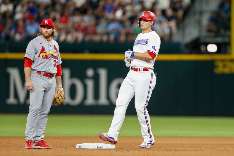 Jun 7, 2023; Arlington, Texas, USA; Texas Rangers shortstop Corey Seager (5) hits a double during the seventh inning against the St. Louis Cardinals at Globe Life Field. Mandatory Credit: Andrew Dieb-USA TODAY Sports