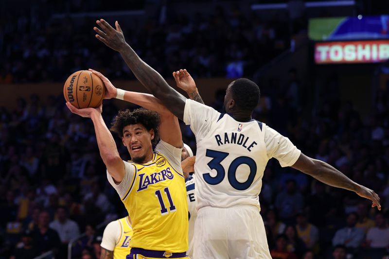 LOS ANGELES, CALIFORNIA - OCTOBER 22: Jaxson Hayes #11 of the Los Angeles Lakers makes a move on Julius Randle #30 of the Minnesota Timberwolves during the second quarter at Crypto.com Arena on October 22, 2024 in Los Angeles, California. (Photo by Harry How/Getty Images)