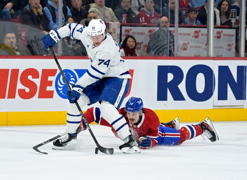 Mar 9, 2024; Montreal, Quebec, CAN: Toronto Maple Leafs forward Bobby McMann (74) takes the puck away from Montreal Canadiens defenseman Arber Xhekaj (72) during the first period at the Bell Centre. Mandatory Credit: Eric Bolte-USA TODAY Sports