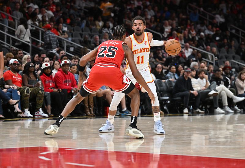 ATLANTA, GEORGIA - NOVEMBER 09: Trae Young #11 of the Atlanta Hawks handles the ball during the game against the Chicago Bulls on November 9, 2024 at State Farm Arena in Atlanta, Georgia.    NOTE TO USER: User expressly acknowledges and agrees that, by downloading and or using this photograph, User is consenting to the terms and conditions of the Getty Images License Agreement.  (Photo by Paras Griffin/Getty Images)