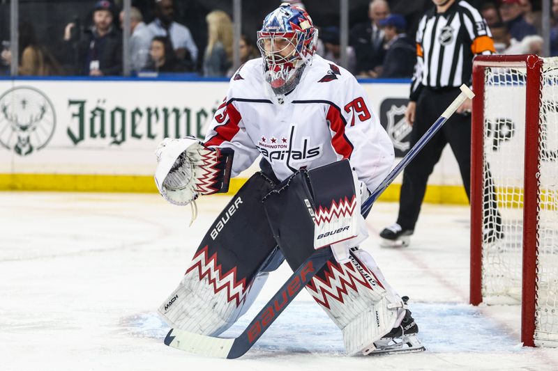 Apr 21, 2024; New York, New York, USA; Washington Capitals goaltender Charlie Lindgren (79) defends the net in the second period against the New York Rangers in game one of the first round of the 2024 Stanley Cup Playoffs at Madison Square Garden. Mandatory Credit: Wendell Cruz-USA TODAY Sports