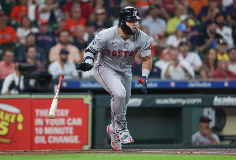 Aug 20, 2024; Houston, Texas, USA; Boston Red Sox right fielder Wilyer Abreu (52) hits an RBI double during the first inning against the Houston Astros at Minute Maid Park. Mandatory Credit: Troy Taormina-USA TODAY Sports
