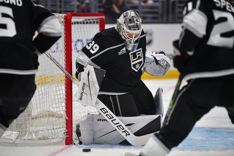 Apr 18, 2024; Los Angeles, California, USA; Los Angeles Kings goaltender Cam Talbot (39) blocks a shot against the Chicago Blackhawks during the first period at Crypto.com Arena. Mandatory Credit: Gary A. Vasquez-USA TODAY Sports