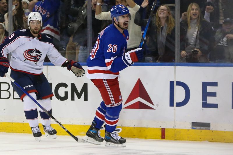 Nov 12, 2023; New York, New York, USA;  New York Rangers left wing Chris Kreider (20) celebrates after making an assist on a game tying goal in the third period against the Columbus Blue Jackets at Madison Square Garden. Mandatory Credit: Wendell Cruz-USA TODAY Sports