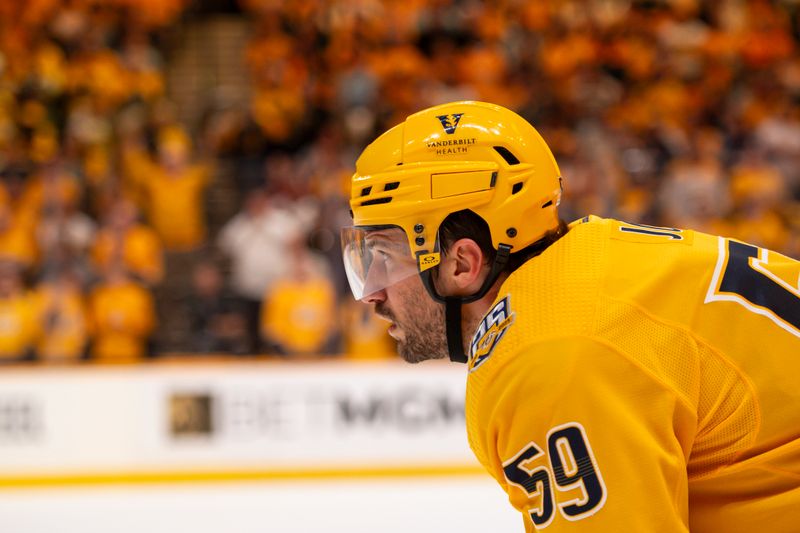 Apr 26, 2024; Nashville, Tennessee, USA; Nashville Predators defenseman Roman Josi (59) awaits the face-off against the Vancouver Canucks during the third period in game three of the first round of the 2024 Stanley Cup Playoffs at Bridgestone Arena. Mandatory Credit: Steve Roberts-USA TODAY Sports