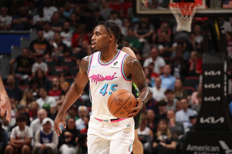 MIAMI, FL - FEBRUARY 10:  Davion Mitchell #45 of the Miami Heat dribbles the ball during the game against the Boston Celtics on February 10, 2025 at Kaseya Center in Miami, Florida. NOTE TO USER: User expressly acknowledges and agrees that, by downloading and or using this Photograph, user is consenting to the terms and conditions of the Getty Images License Agreement. Mandatory Copyright Notice: Copyright 2025 NBAE (Photo by Issac Baldizon/NBAE via Getty Images)