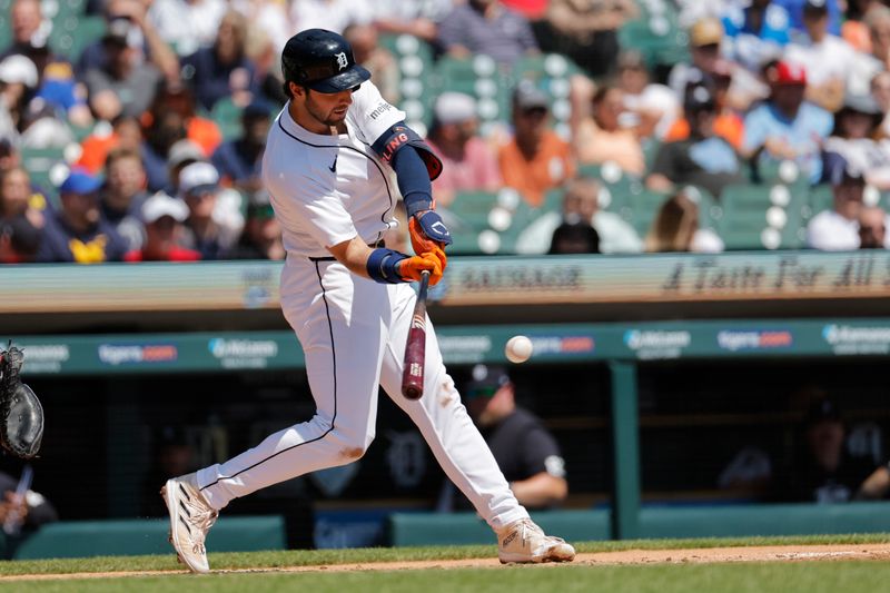 May 1, 2024; Detroit, Michigan, USA; Detroit Tigers center fielder Matt Vierling (8) hits a single in the second inning against the St. Louis Cardinals at Comerica Park. Mandatory Credit: Rick Osentoski-USA TODAY Sports