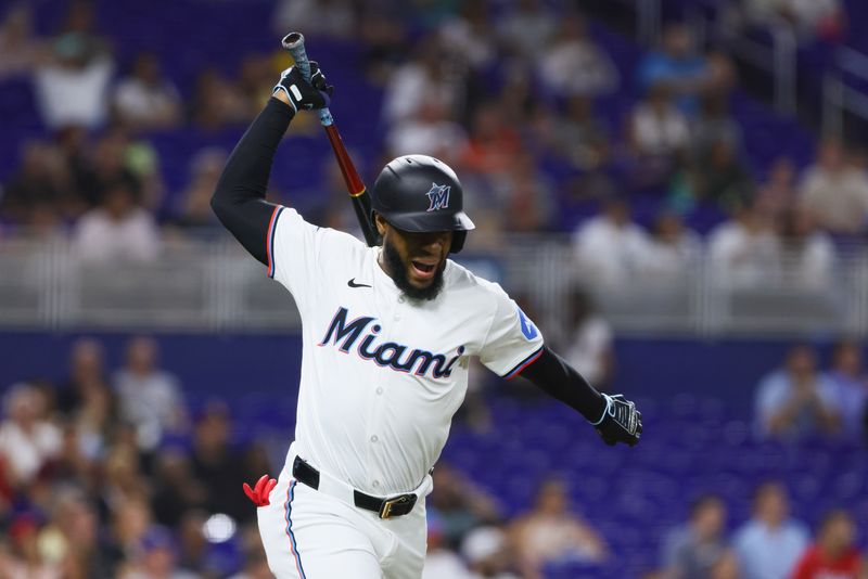 Jun 5, 2024; Miami, Florida, USA; Miami Marlins left fielder Bryan De La Cruz (14) reacts after flying out against the Tampa Bay Rays during the fifth inning at loanDepot Park. Mandatory Credit: Sam Navarro-USA TODAY Sports