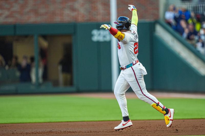 Apr 21, 2024; Cumberland, Georgia, USA; Atlanta Braves designated hitter Marcell Ozuna (20) reacts after hitting a three run home run against the Texas Rangers during the first inning at Truist Park. Mandatory Credit: Dale Zanine-USA TODAY Sports