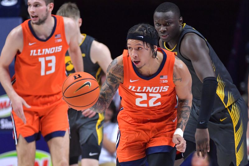 Feb 25, 2025; Champaign, Illinois, USA;  Illinois Fighting Illini guard Tre White (22) drives the ball up court during the first half against the Iowa Hawkeyes at State Farm Center. Mandatory Credit: Ron Johnson-Imagn Images