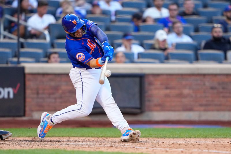 Sep 14, 2023; New York City, New York, USA; New York Mets catcher Francisco Alvarez (4) hits a double against the Arizona Diamondbacks during the seventh inning at Citi Field. Mandatory Credit: Gregory Fisher-USA TODAY Sports