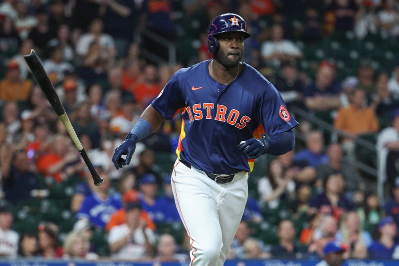 Apr 2, 2024; Houston, Texas, USA; Houston Astros left fielder Yordan Alvarez (44) hits a single during the fourth inning against the Toronto Blue Jays at Minute Maid Park. Mandatory Credit: Troy Taormina-USA TODAY Sports