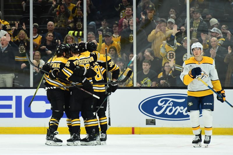 Mar 4, 2025; Boston, Massachusetts, USA;  Boston Bruins defenseman Jordan Oesterle (82) is congratulated by his teammates after scoring a goal during the second period against the Nashville Predators at TD Garden. Mandatory Credit: Bob DeChiara-Imagn Images