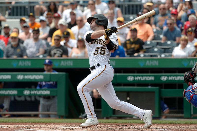 May 24, 2023; Pittsburgh, Pennsylvania, USA; Pittsburgh Pirates catcher Jason Delay (55) hits an RBI single against the Texas Rangers during the second inning at PNC Park. Mandatory Credit: Charles LeClaire-USA TODAY Sports