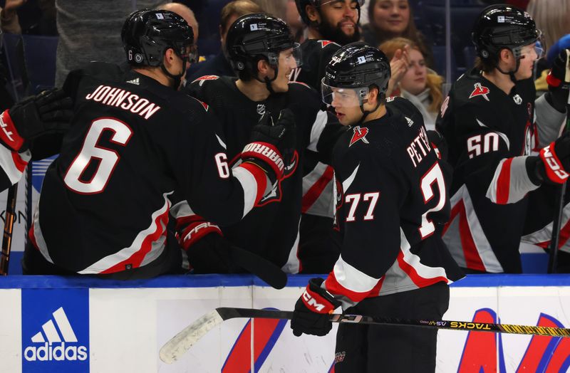 Jan 18, 2024; Buffalo, New York, USA;  Buffalo Sabres right wing JJ Peterka (77) celebrates his goal with teammates during the third period against the Chicago Blackhawks at KeyBank Center. Mandatory Credit: Timothy T. Ludwig-USA TODAY Sports