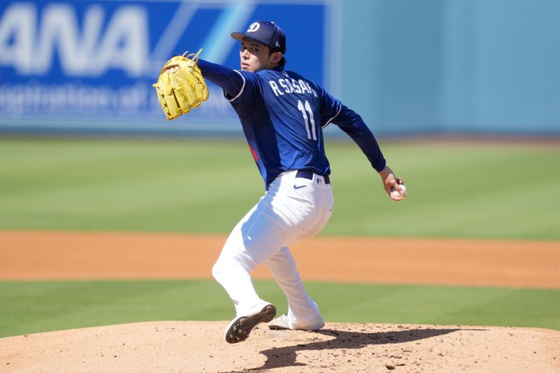 Aug 8, 2025; Los Angeles, California, USA; Los Angeles Dodgers pitcher Roki Sasaki (11) throws before the game against the Toronto Blue Jays at Dodger Stadium. Mandatory Credit: Kirby Lee-Imagn Images