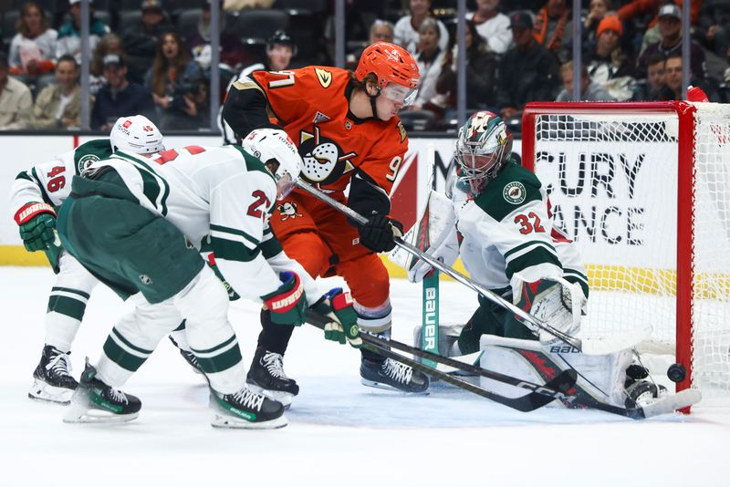 Nov 8, 2024; Anaheim, California, USA; Anaheim Ducks center Leo Carlsson (91) shoots and Minnesota Wild goaltender Filip Gustavsson (32) makes a save during the second period of a hockey game at Honda Center. Mandatory Credit: Jessica Alcheh-Imagn Images