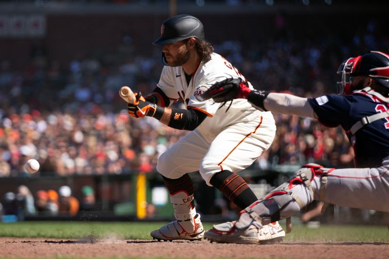 Jul 30, 2023; San Francisco, California, USA; San Francisco Giants shortstop Brandon Crawford (35) bunts for a base hit against the Boston Red Sox during the 11th inning at Oracle Park. Mandatory Credit: D. Ross Cameron-USA TODAY Sports