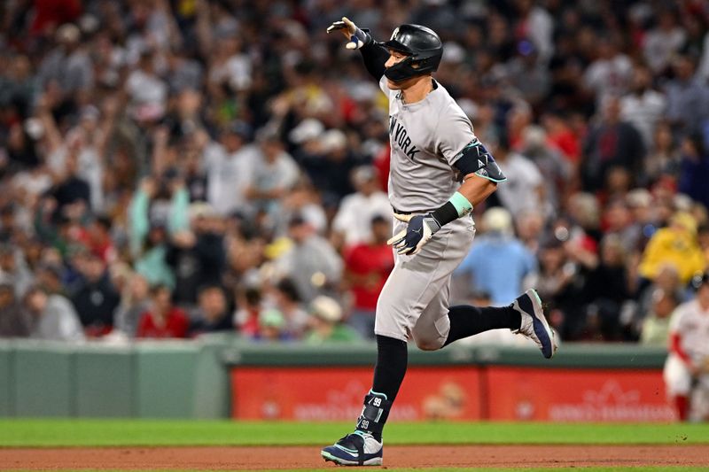 Sep 14, 2025; Boston, Massachusetts, USA;  New York Yankees right fielder Aaron Judge (99) runs the bases after hitting a solo home run against the Boston Red Sox during the fifth inning at Fenway Park. Mandatory Credit: Brian Fluharty-Imagn Images