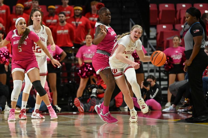 Jan 31, 2024; College Park, Maryland, USA;  Indiana Hoosiers guard Lexus Bargesser (1) reacts awhile Maryland Terrapins guard Bri McDaniel (24) guards along there sidelines during the second half at Xfinity Center. Mandatory Credit: Tommy Gilligan-USA TODAY Sports