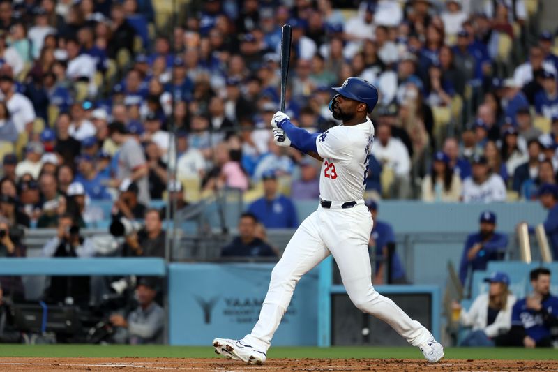 Jun 1, 2024; Los Angeles, California, USA;  Los Angeles Dodgers right fielder Jason Heyward (23) hits an RBI double during the second inning against the Colorado Rockies at Dodger Stadium. Mandatory Credit: Kiyoshi Mio-USA TODAY Sports