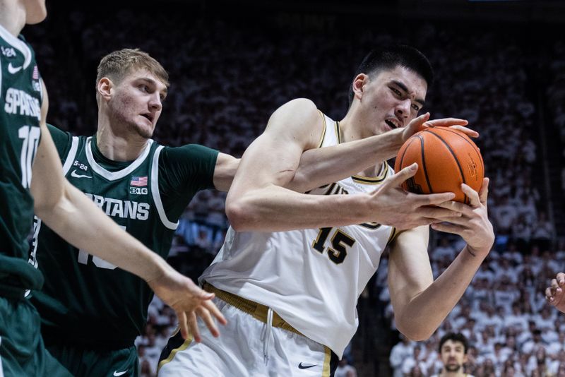 Jan 29, 2023; West Lafayette, Indiana, USA;  Purdue Boilermakers center Zach Edey (15) and Michigan State Spartans center Carson Cooper (15) fight for a rebound in the second half at Mackey Arena. Mandatory Credit: Trevor Ruszkowski-USA TODAY Sports