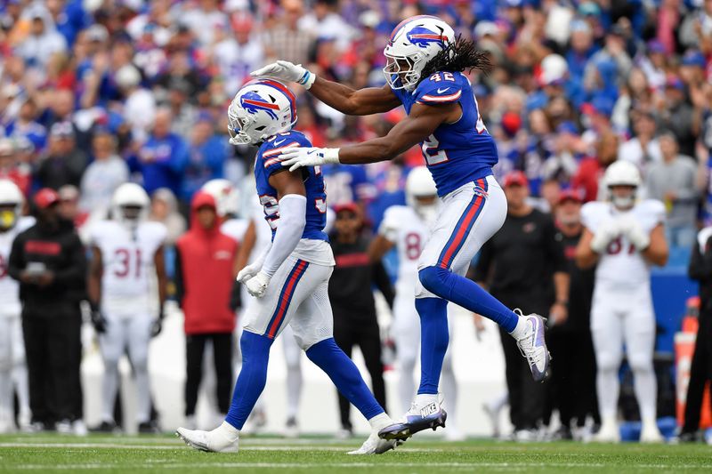 Buffalo Bills defensive back Cam Lewis, left, celebrates with linebacker Dorian Williams during the second half of an NFL football game against the Arizona Cardinals in Orchard Park, N.Y., Sunday, Sept. 8, 2024. (AP Photo/Adrian Kraus)