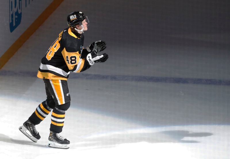 Mar 17, 2024; Pittsburgh, Pennsylvania, USA;  Pittsburgh Penguins right wing Valtteri Puustinen (48) reacts after being named a star of the game against the Detroit Red Wings at PPG Paints Arena. Pittsburgh won 6-3. Mandatory Credit: Charles LeClaire-USA TODAY Sports 