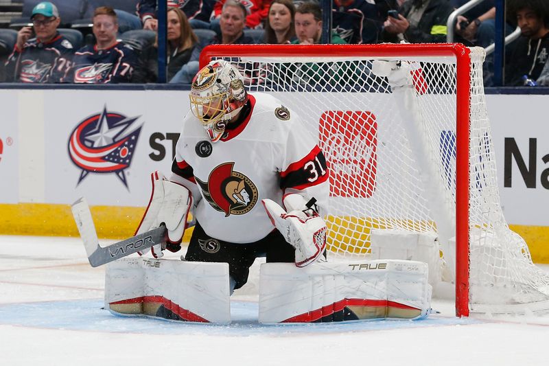 Mar 14, 2024; Columbus, Ohio, USA; Ottawa Senators goalie Anton Forsberg (31) makes a save against the Columbus Blue Jackets during the third period at Nationwide Arena. Mandatory Credit: Russell LaBounty-USA TODAY Sports