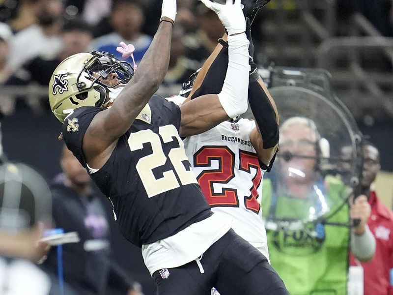 Tampa Bay Buccaneers cornerback Zyon McCollum (27) defends against a pass intended for New Orleans Saints wide receiver Rashid Shaheed (22) during the second half of an NFL football game in New Orleans, Sunday, Oct. 13, 2024. (AP Photo/Michael Conroy)