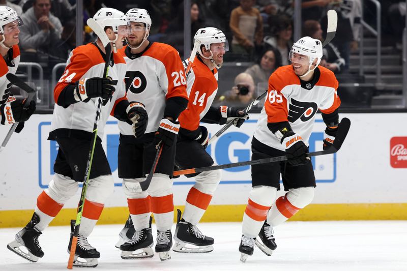 Nov 11, 2023; Los Angeles, California, USA;  Philadelphia Flyers center Sean Couturier (14) and right wing Cam Atkinson (89) react after Atkinson scores a goal during the third period against the Los Angeles Kings at Crypto.com Arena. Mandatory Credit: Kiyoshi Mio-USA TODAY Sports