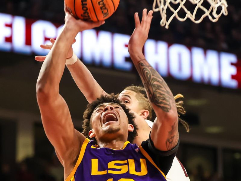 Feb 17, 2024; Columbia, South Carolina, USA; LSU Tigers forward Jalen Reed (13) shoots against the South Carolina Gamecocks in the second half at Colonial Life Arena. Mandatory Credit: Jeff Blake-USA TODAY Sports