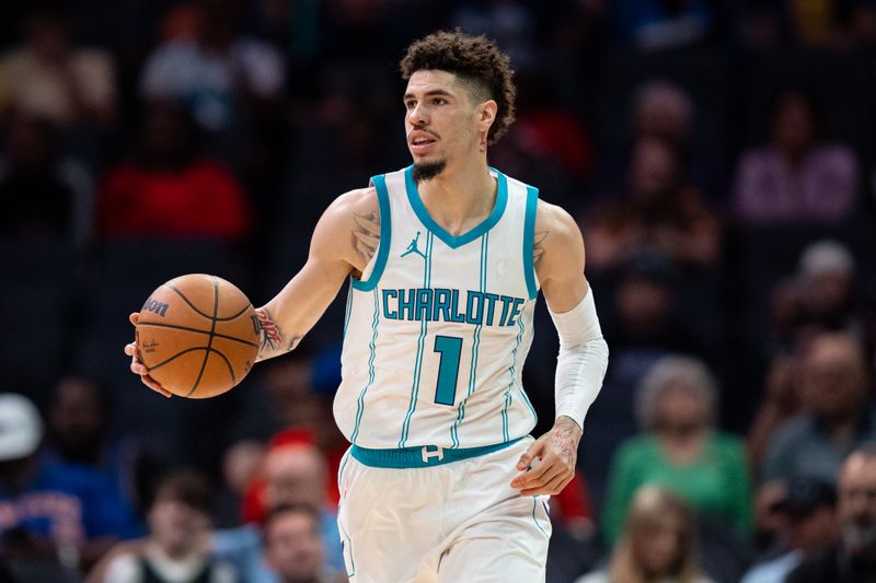 CHARLOTTE, NORTH CAROLINA - OCTOBER 06: LaMelo Ball #1 of the Charlotte Hornets brings the ball up court in the first quarter during a preseason game /N at Spectrum Center on October 06, 2024 in Charlotte, North Carolina. NOTE TO USER: User expressly acknowledges and agrees that, by downloading and or using this photograph, User is consenting to the terms and conditions of the Getty Images License Agreement. (Photo by Jacob Kupferman/Getty Images)